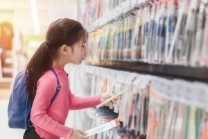 Back,To,School,Concept,,Little,Asian,Girl,Or,Pupil,Buying little girl choosing school supplies